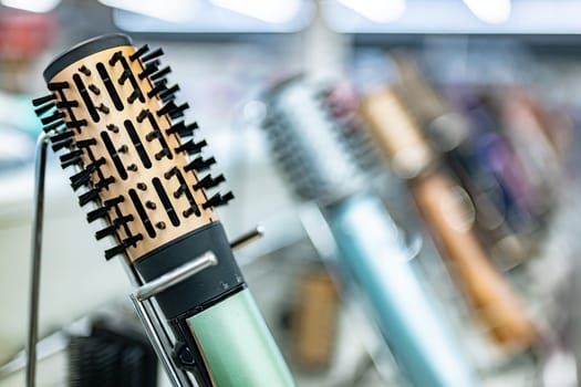 Hair dryers put up for sale in a home appliance store.