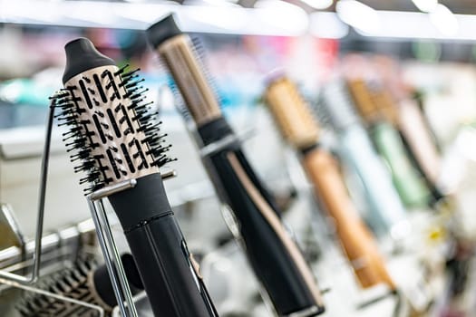 Hair dryers put up for sale in a home appliance store.