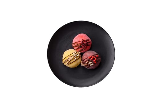Delicious colorful asian mochi sweets with rice dough shell and fruit filling on white background