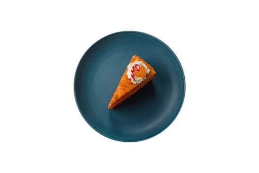 Piece of sweet layer cake with pumpkin or citrus flavor with cream on a white background