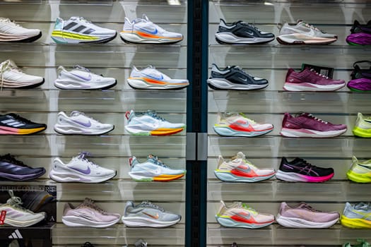 POZNAN, POL -  DEC 5, 2024: Sport shoes put up for sale in a store.