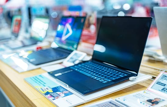 POZNAN, POL - DEC 5, 2024: Laptop computers put up for sale in a store.
