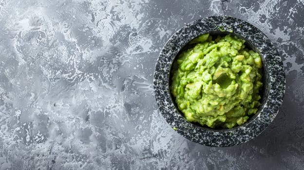 Artisanal guacamole seasoned with spices, garnished with cilantro beside a ripe avocado, combining tradition with gourmet appeal. The dark mortar sets off the green hues vividly