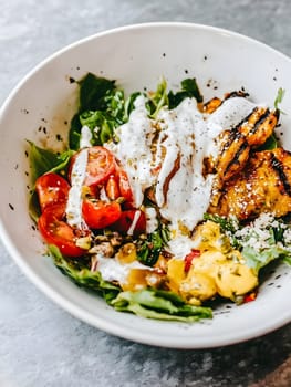 Tasty Mixed Salad vegetables with American Dressing meal dish