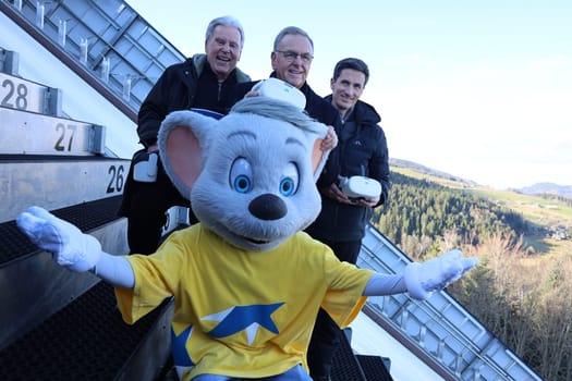 High up with the Euromaus on the inrun tower of the large Adlerschanze: v.li. Former mayor Hansjörg Eckert (Hinterzarten),Dr. Roland Mack (Managing Director Europapark Rust),ski jumping world champion Martin Schmitt (Freiburg),  at the press event VR-Experience Europapark Rust Hinterzarten