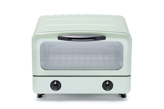 Close-up of a modern toaster oven with dials, compact kitchen appliance.