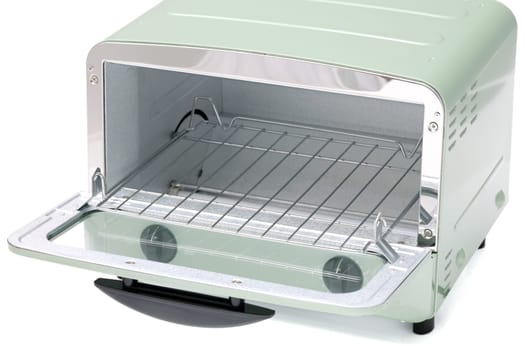 Close-up of a modern toaster oven with dials, compact kitchen appliance.