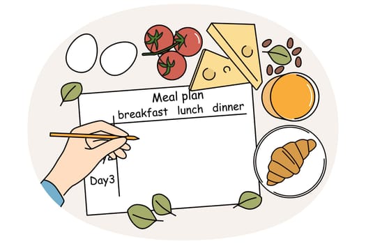 Meal plan on table of nutritionist near ingredients for preparing beneficial food and person hand with pencil. Human prepares meal plan for weight loss or low-calorie diet with healthy effect