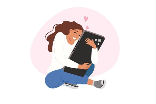 Teenage girl is experiencing addiction from social networks and using smartphone, sitting on floor hugging large phone. Problem of digital addiction and devoting all free time to internet surfing