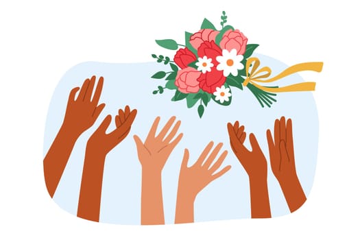 Wedding bouquet over hands of maids of honor fighting for flowers thrown by bride. Traditional wedding ritual or competition with bouquet to entertain guests and determine next newlywed