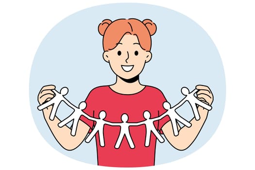 Little girl calls for solidarity and collaboration, showing paper people holding hands. Schoolgirl looks at screen with smile calling for solidarity and building alliances to fight discrimination