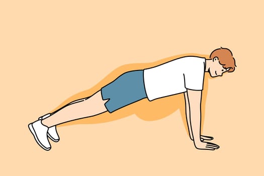 Man doing push-ups makes progress in losing weight, and feels disappearance of thanks to fitness and sports. Guy demonstrates correct execution of push-ups from floor to achieve result