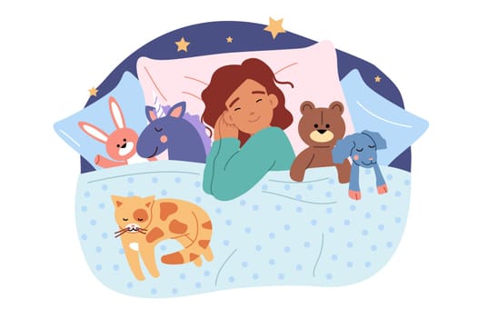 Little girl sleeps in bed among plush toys, and dreams while resting after day walk. Preschool child lies on pillow under blanket and sleeps, gaining strength and energy for new day.