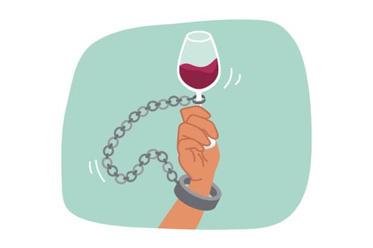 Alcohol addiction is suffered by man with glass of red wine and shackles, due to lack of willpower. Problem of alcohol addiction and slavery from bad habits, destroying life of victim