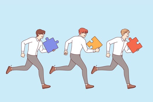 Teamwork of business men running together side by side with puzzle pieces in hands to complete task. Teamwork or competition between office clerks competing for leadership for career success