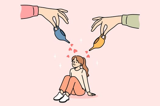 Parents care and give love to little girl by showering baby with miniature jugs with hearts. Happy child sitting on floor, growing up in loving family thanks to parents investing in daughter