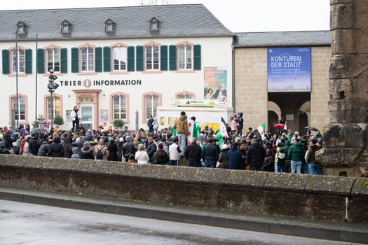 Syrians celebrate after Assad regime toppled, war in the middle east, rebels and islamists, Porta Nigra in Trier, Germany, 08.12.2024