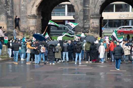 Syrians celebrate after Assad regime toppled, war in the middle east, rebels and islamists, Porta Nigra in Trier, Germany, 08.12.2024