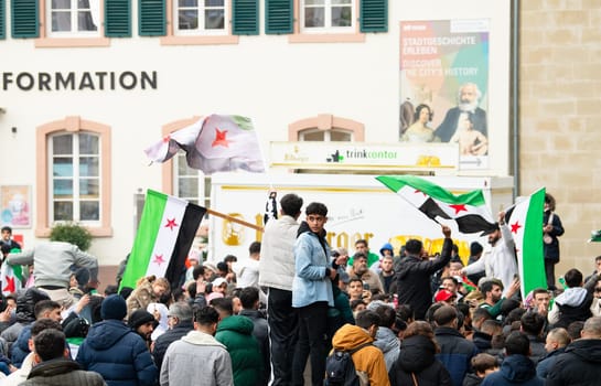 Syrians celebrate after Assad regime toppled, war in the middle east, rebels and islamists, Porta Nigra in Trier, Germany, 08.12.2024