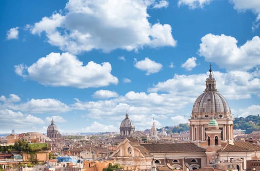 Rome, Italy. Urban landscape, blue sky with clouds, church exterior architecture.