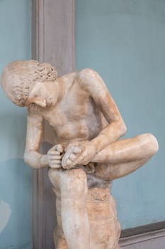 Florence, Italy - June 30 2024: Uffizi Museum, Boy with thorn, also known as Spinario, 1st century BC, Italic marble