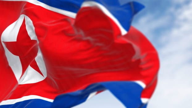 Close-up of North Korea national flag waving in the wind on a clear day. Red flag with star and blue white stripes. 3d illustration render, Rippling fabric. Selective focus