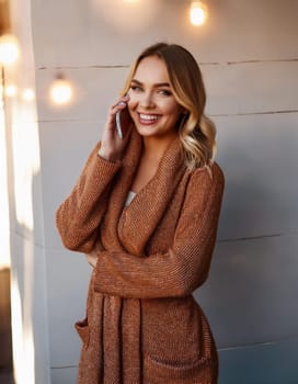 pretty young woman talking on mobile telephone, AI generated image
