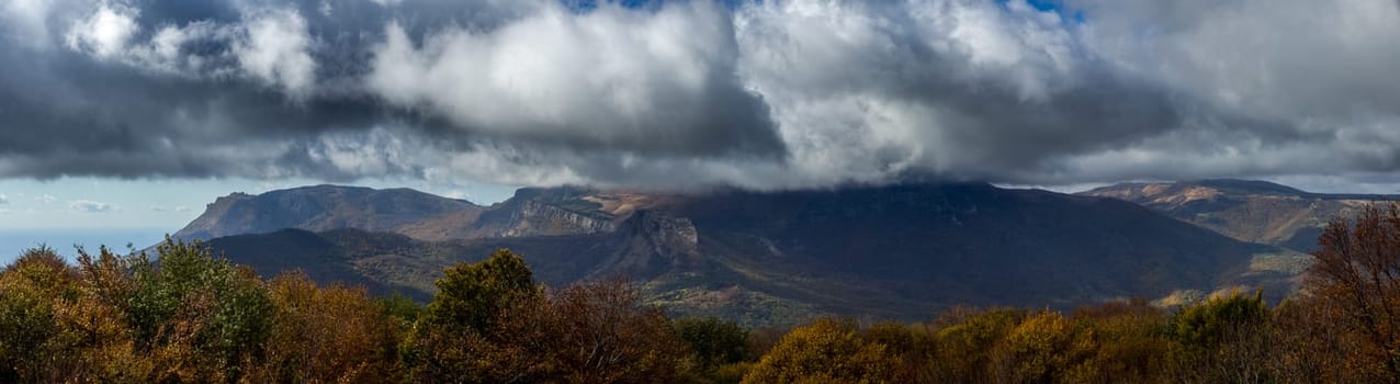 Beautiful cumulus clouds over the mountains and valleys of Crimea. The landscape of the nature of Crimea.