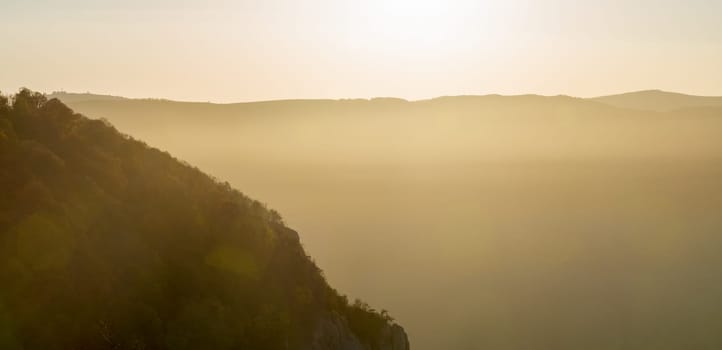 Sunset in the mountains of Crimea, Sunset landscape with rays of sun and mountains.