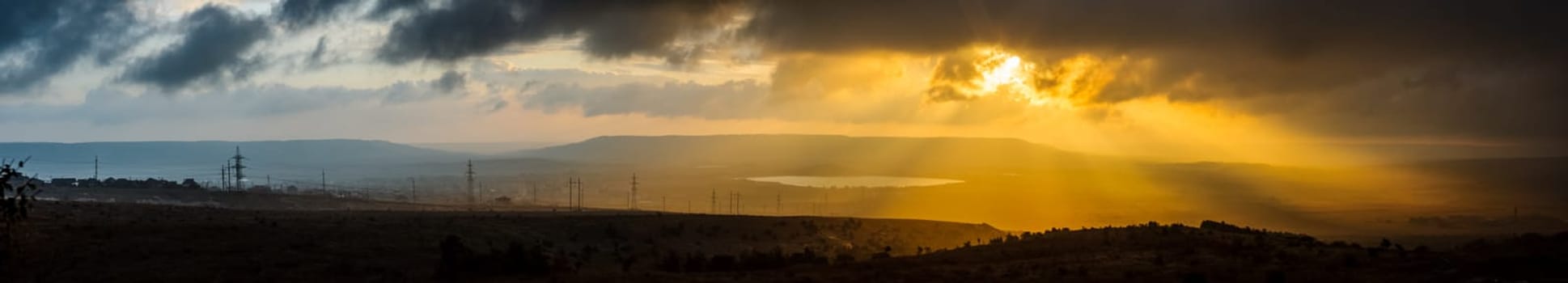 Sunset in the mountains of Crimea, Sunset landscape with rays of sun and mountains.