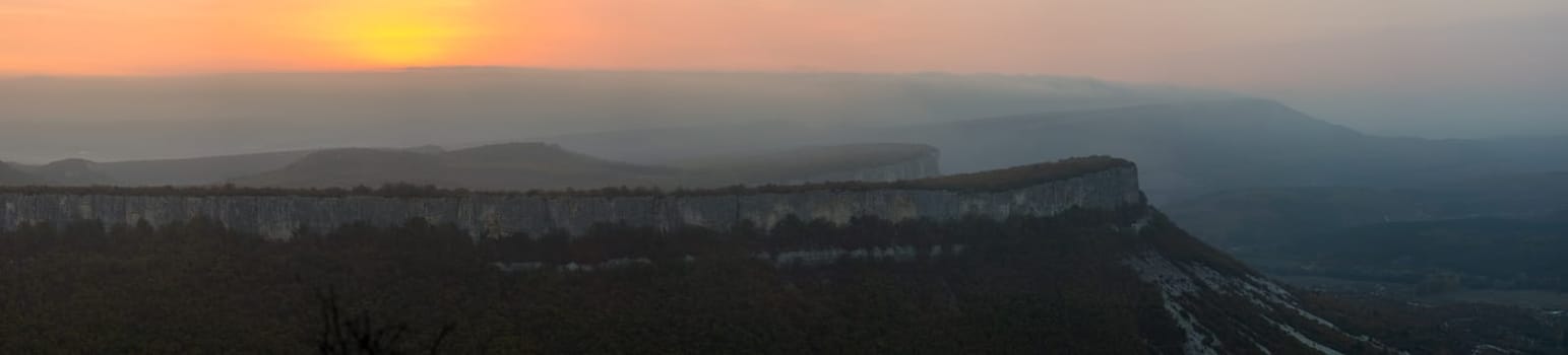 Sunset in the mountains of Crimea, Sunset landscape with rays of sun and mountains.