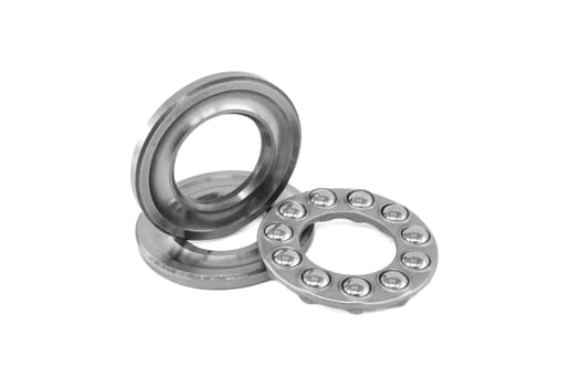Thrust ball bearing isolated on white background, spare parts for machinery and automotive industry, full depth of field