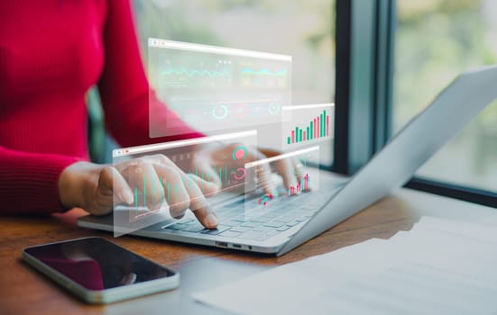 Professional women wearing red sweater working about new startup on laptop to analysis finance of project in outside office, Woman working using laptop online meeting in home office.