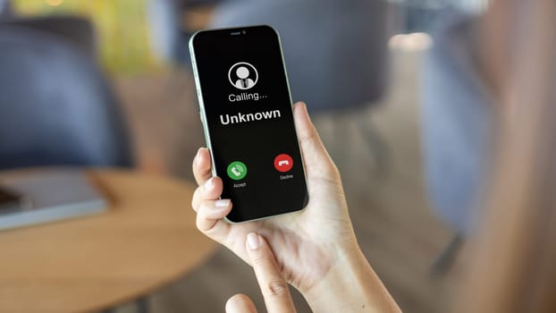 Scam with mobile phone, Woman receives a phone call from an unknown number, Concept of scammers or strangers, Fraud and contact to sell mobile internet promotions, Spam, Fake identity, Scammer.