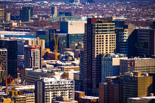 Cranes and buildings in the city. Shooting Location: montreal, canada