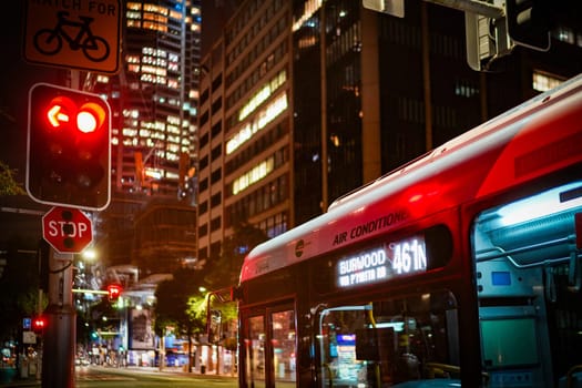 Night view of traffic lights and buses. Shooting Location: sydney, australia