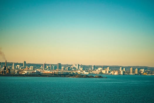 Evening view of the industrial city by the water. Shooting Location: Toronto