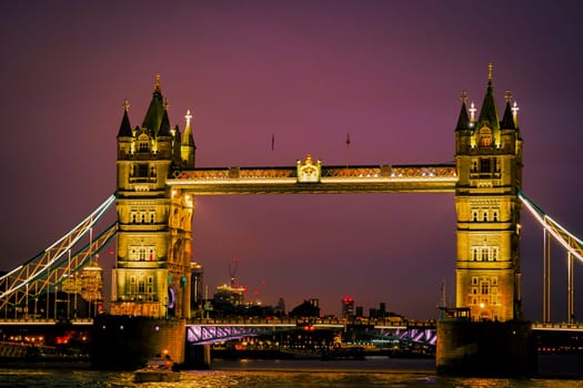 Illuminated tower bridge at dusk. Shooting Location: UK, London