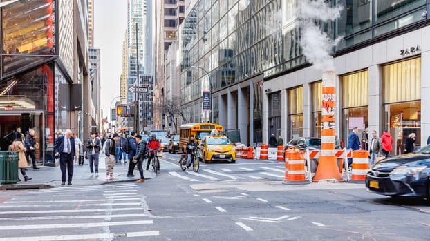 Manhattan, New York City, USA - February 15, 2023: Street atmosphere and architecture in the old city center on a beautiful winter day