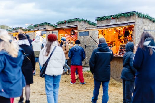 Tiffauges, Vendee, France - December 8, 2024: Street atmosphere and architecture at the Christmas Market at Tiffauges Castle on a gray winter day