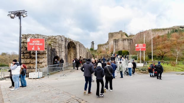 Tiffauges, Vendee, France - December 8, 2024: Street atmosphere and architecture at the Christmas Market at Tiffauges Castle on a gray winter day