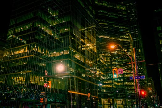 Glass building and intersection at night. Shooting Location: Toronto