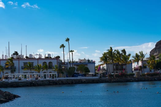 CRAN CANARIA, PUERTO DE MOGAN- NOVEMBER 15, 2019: Cran Canaria, Puerto de Mogan, Spain - November 15, 2019: View from the observation deck over the old town to Marina, Puerto de Mogan, Gran Canaria, Canary Islands, Spain