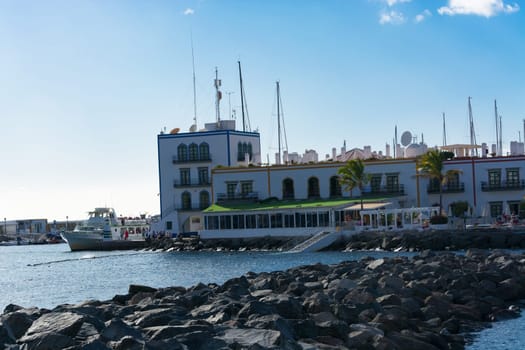 CRAN CANARIA, PUERTO DE MOGAN- NOVEMBER 15, 2019: Cran Canaria, Puerto de Mogan, Spain - November 15, 2019: View from the observation deck over the old town to Marina, Puerto de Mogan, Gran Canaria, Canary Islands, Spain