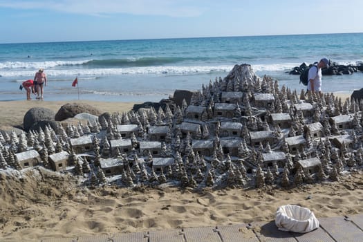 CRAN CANARIA, MELONERAS - NOVEMBER 13, 2019: Cran Canaria, Meloneras, Spain - November 13, 2019: Christmas Village of sand on the beach of Cran Canaria in Meloneras