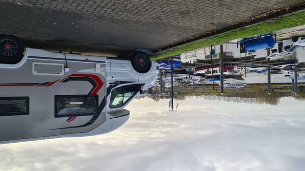 VENLO,  NETHERLANDS - NOVEMBER 07, 2021: Venlo, Netherlands - JNovember 07, 2021:  Motorhome in the small town port of Venlo in Holland, the Netherlands