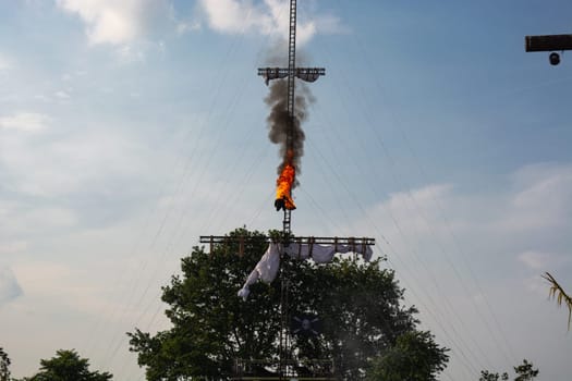SEVENUM, LIMBURG, NETHERLANDS - JULY 17, 2019: Amusement park show event of a pirate race. A man spring burning from a mast Holland, Europe.