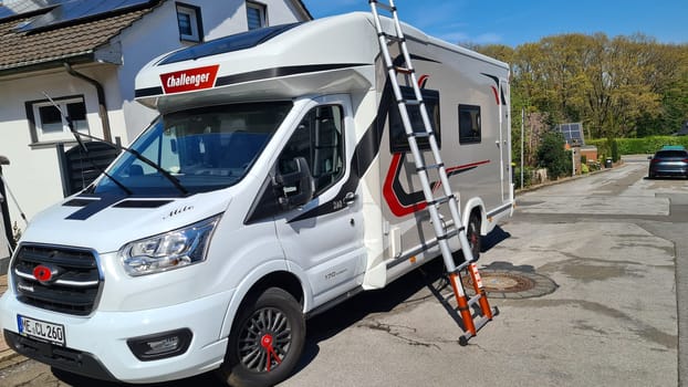 HEILIGENHAUS, NRW, GERMANY - APRIL 19, 2022: Heiligenhaus, Nrw, Germany - April 19, 2022: Motorhomes and campers for sale or rent. Concept freedom, family holiday travel, vacation travel with camper.