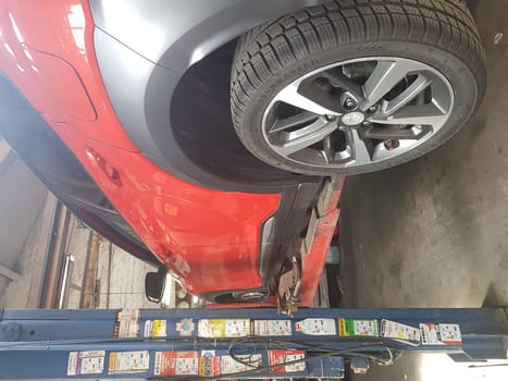 VELBERT, NRW, GERMANY - MAY 05, 2020: Hyundai Kona small SUV car, on the lift in a car repair shop