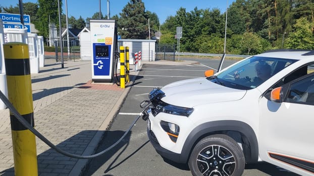 HEILIGENHAUS, NRW, GERMANY - AUGUST 10, 2022: Heiligenhaus, Nrw, Germany - August 10, 2022: Brand new electric Dacia Spring automobile being charged